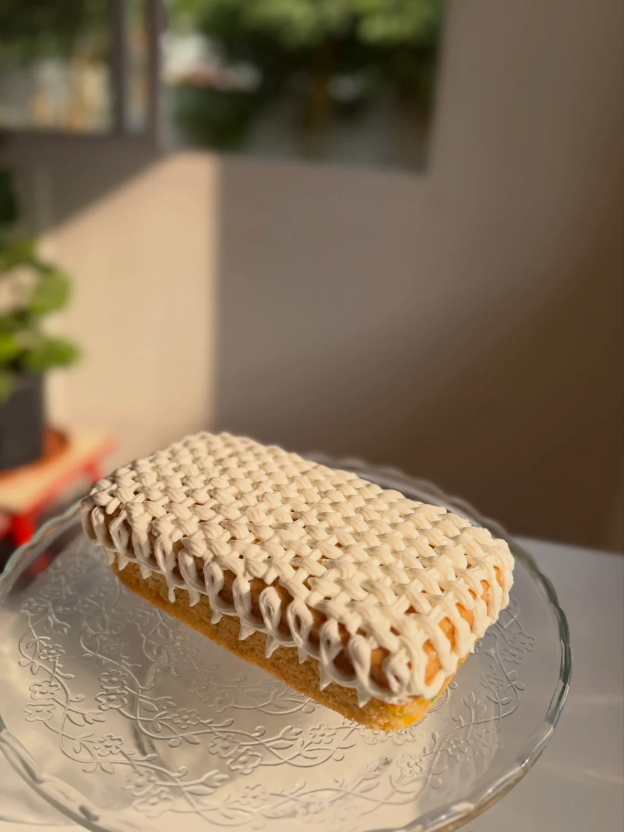 An original Citrus loaf cake with beautiful hand-piped cream